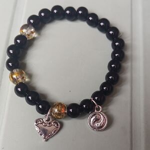 Black Beaded Bracelet with Silver Charms